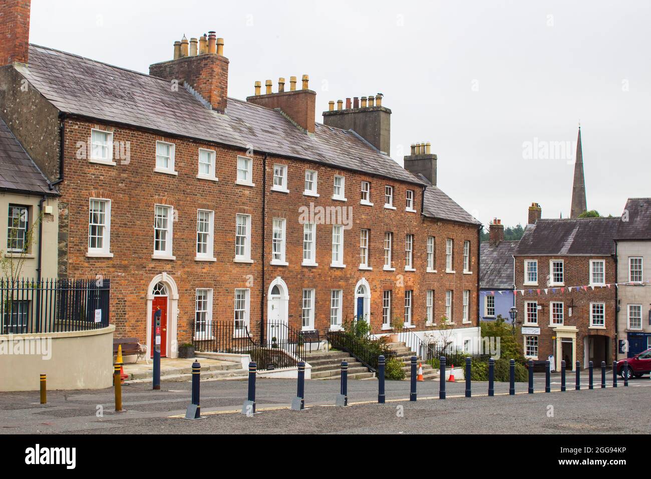 26 August 2021 A row of beautiful Georgian terraced houses located in The Square in the Royal Trust village of Hilsborough in County Down Northern Ire Stock Photo