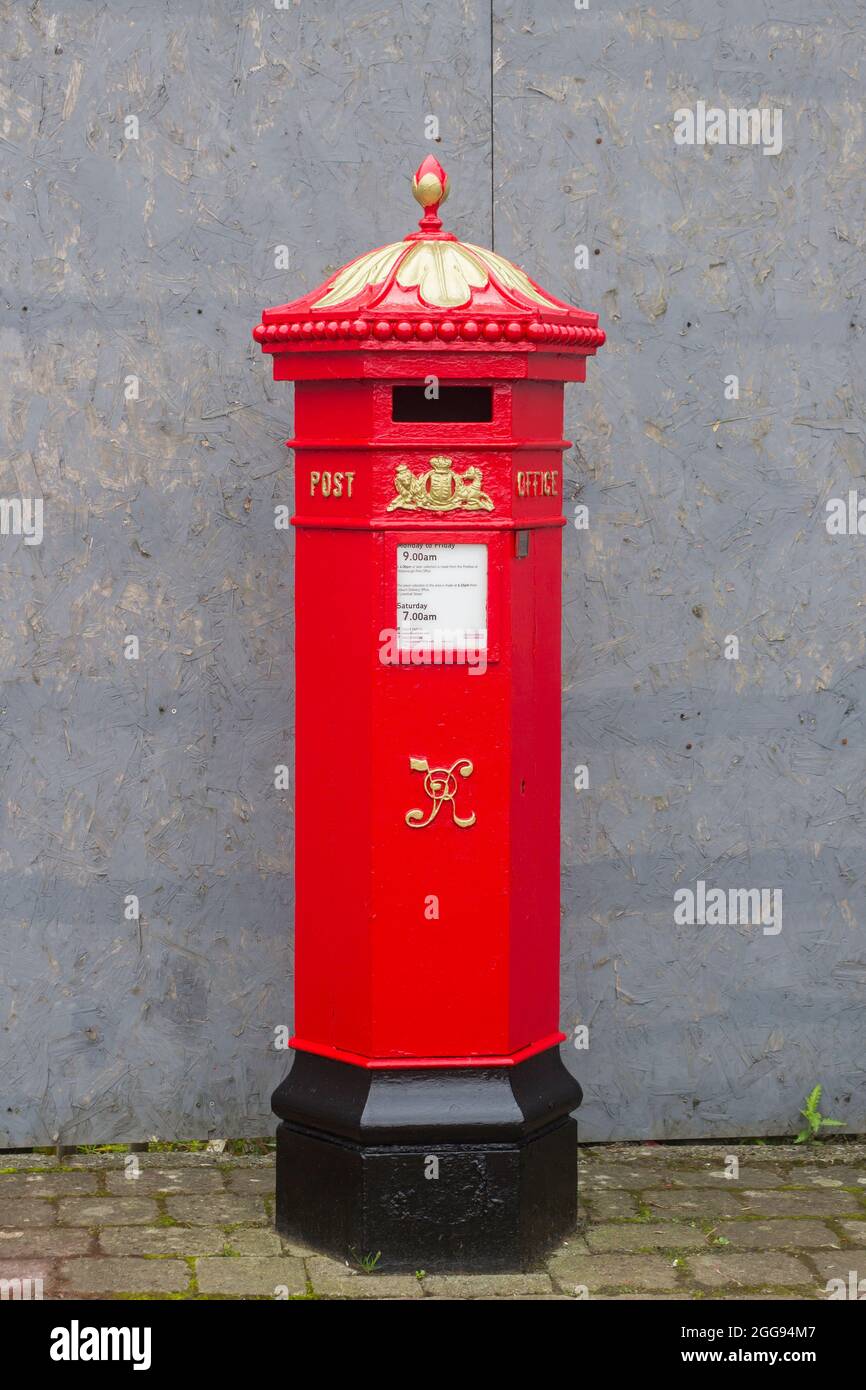26 August 2021 A traditional Victorian Royal Mail pillar box on the main road through the Royal Hillsborough Village in County Down Northern Ireland Stock Photo