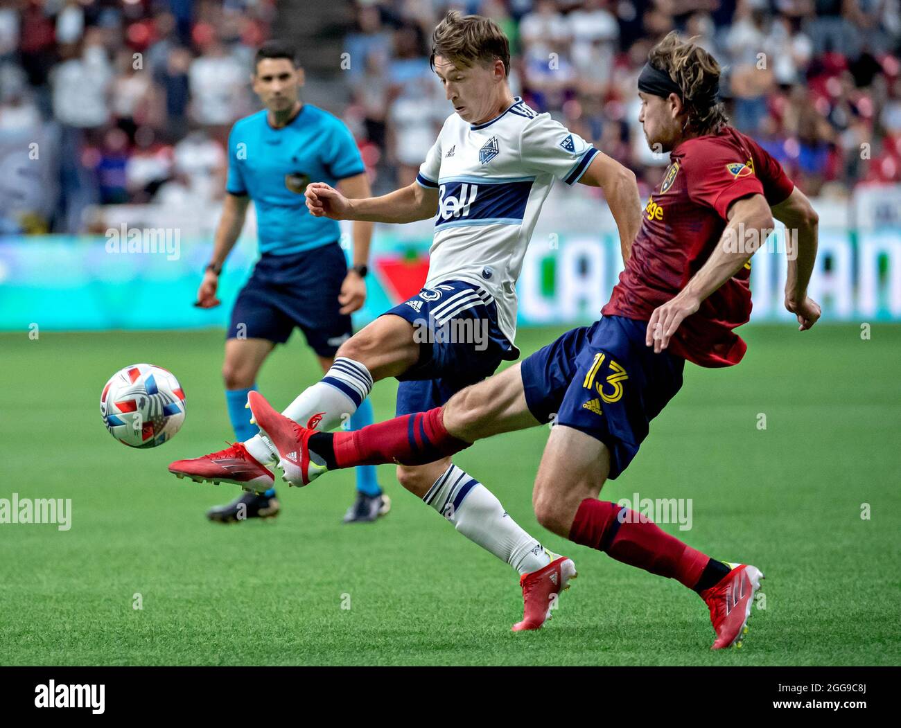 Vancouver, Canada. 29th Aug, 2021. Vancouver Whitecaps' Ryan Gauld (L) vies with Real Salt Lake's Nick Besler during the MLS soccer match between Vancouver Whitecaps and Real Salt Lake at BC Place in Vancouver, Canada, August 29, 2021. Credit: Andrew Soong/Xinhua/Alamy Live News Stock Photo