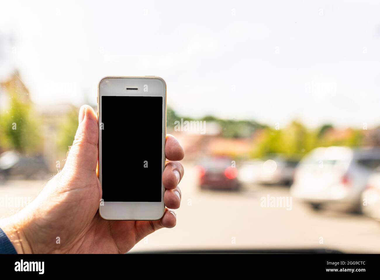 Man using phone in car, GPS navigation ,blank space frame on smartphone