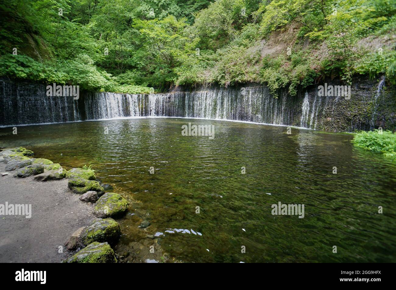 Closeup Shot Of A Beautiful Karuizawa Shiraito Waterfall In Japan Among Green Trees Stock Photo Alamy