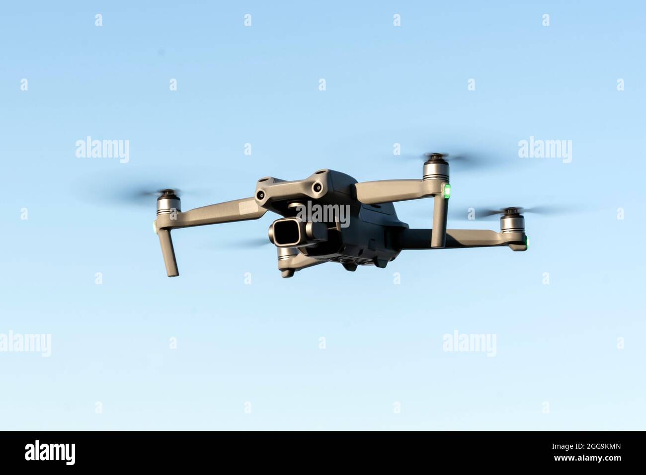 a copter in flight in closeup against the background of a clear blue