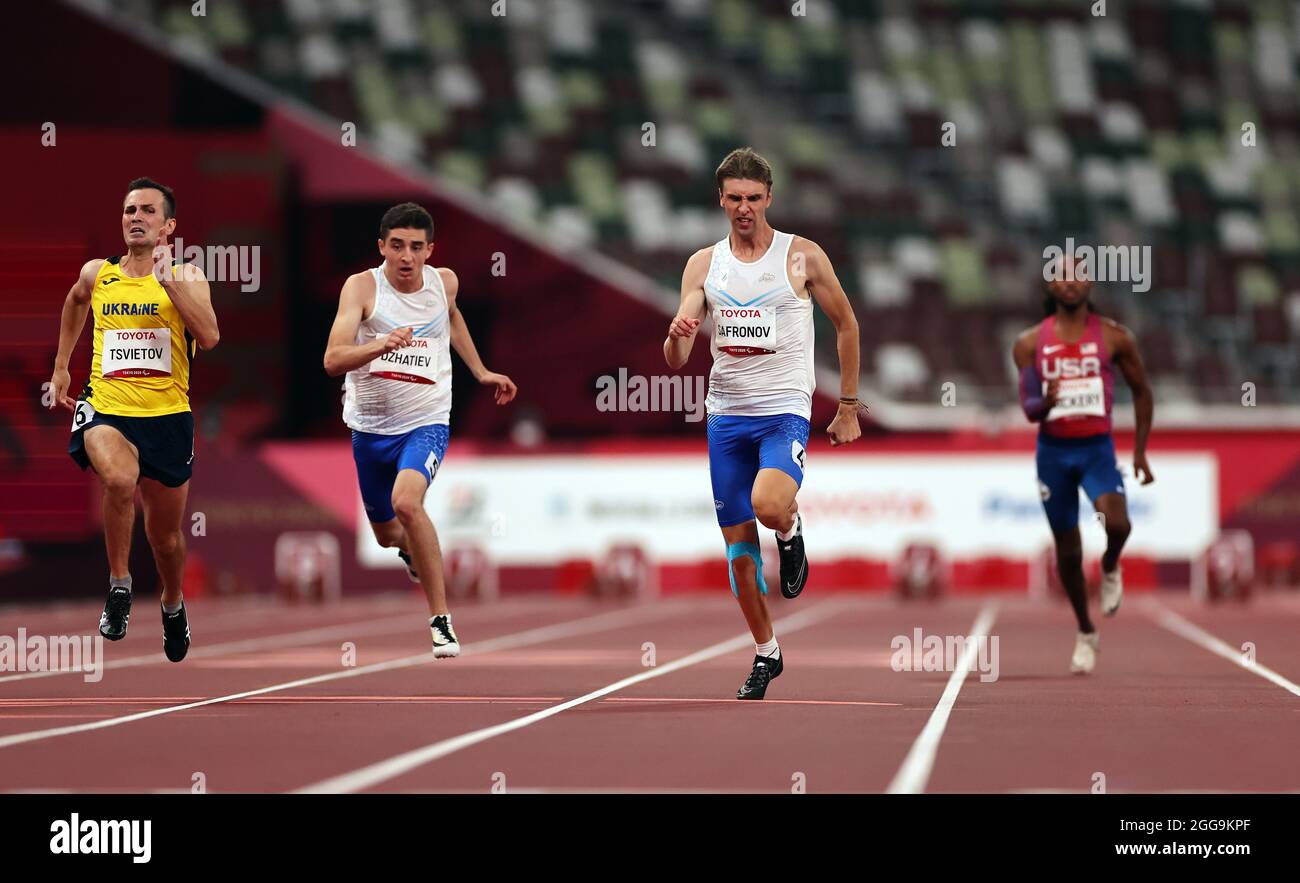 Tokyo 2020 Paralympic Games - Athletics - Men's 100m - T35 Final - Olympic Stadium, Tokyo, Japan - August 30, 2021. Dmitrii Safronov of the Russian Paralympic Committee in action REUTERS/Athit Perawongmetha Stock Photo