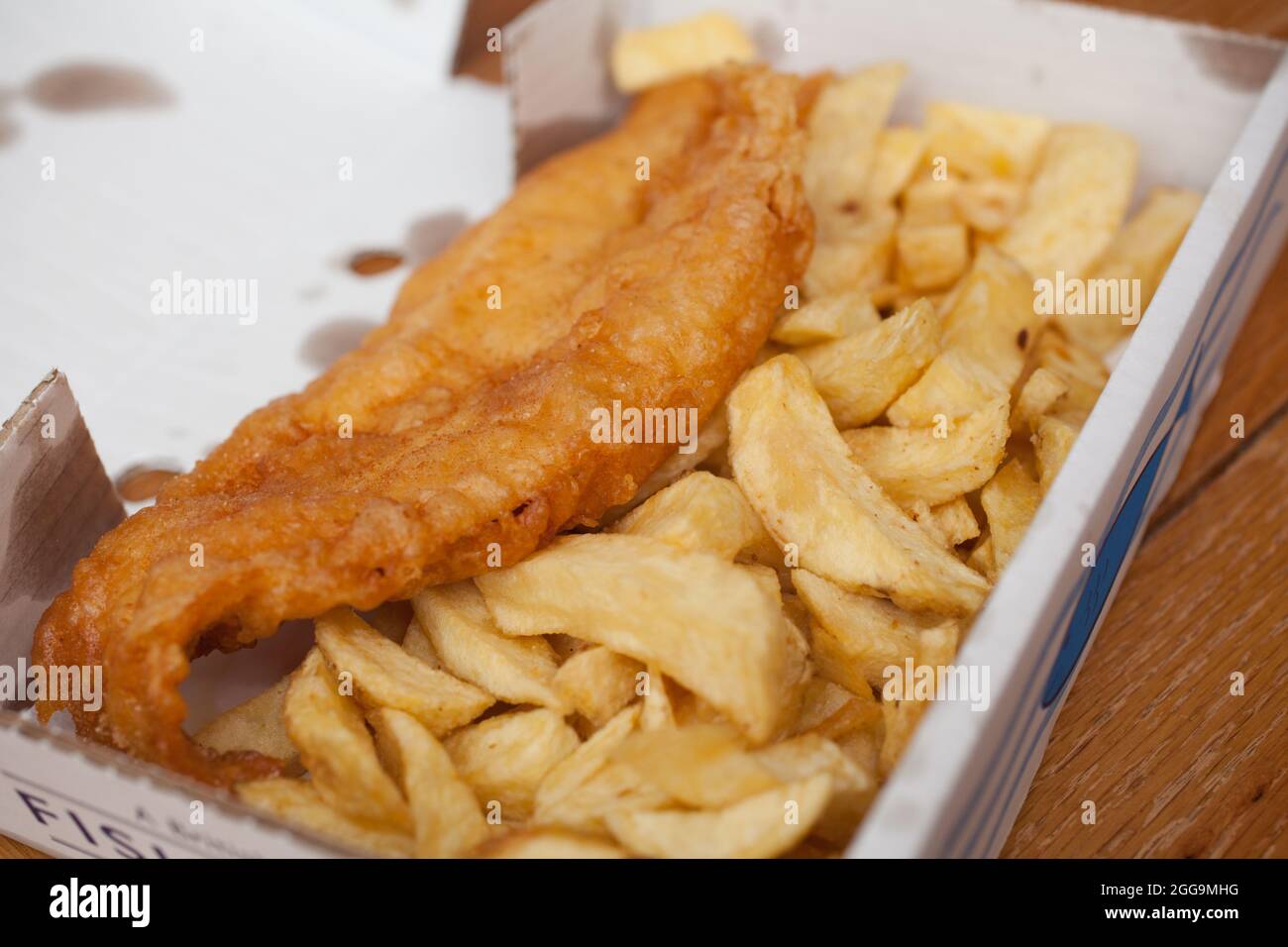 English fish and chips in their box Stock Photo Alamy