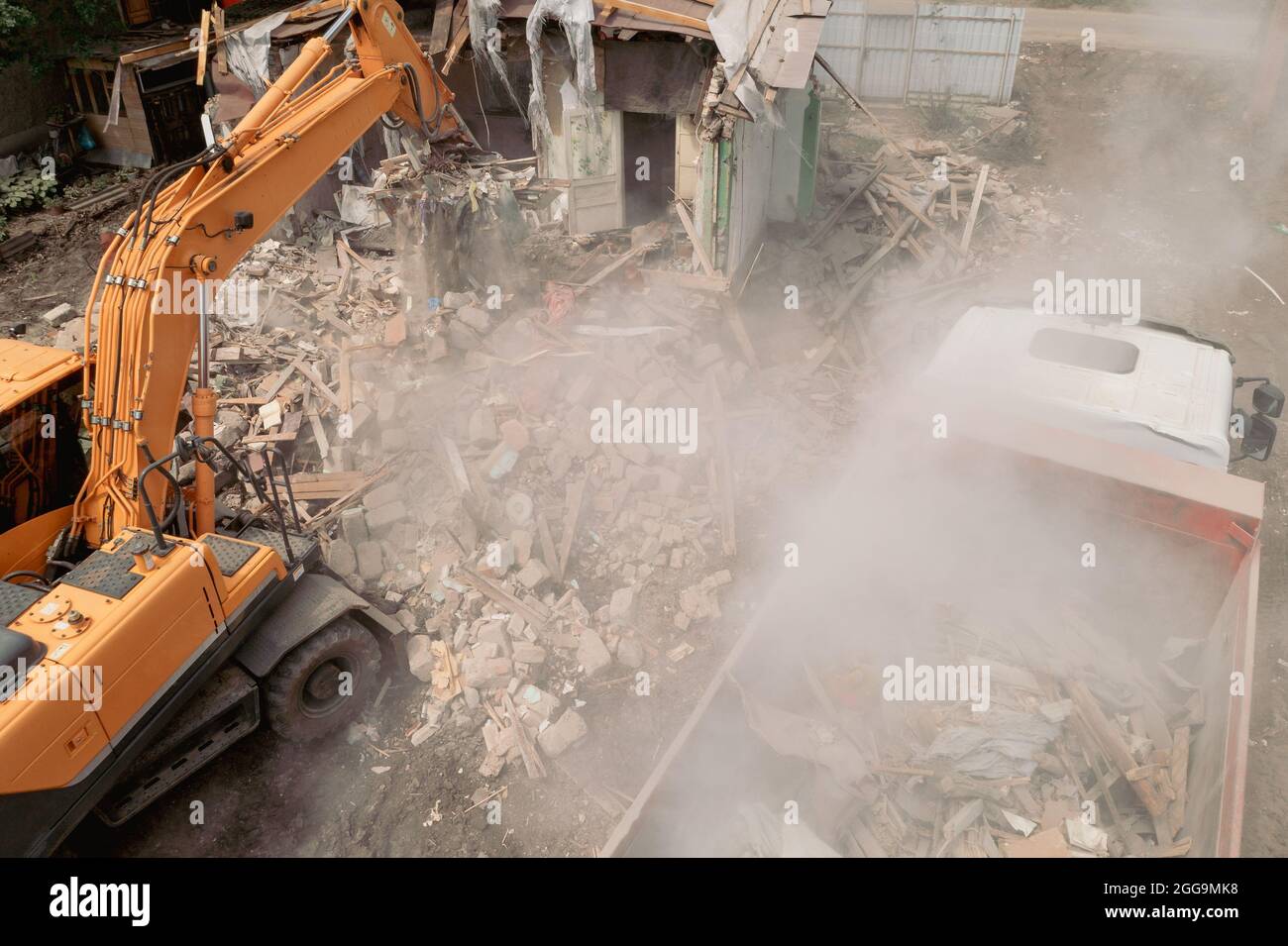 Demolition Of House Building For New Construction. Excavator Bucket