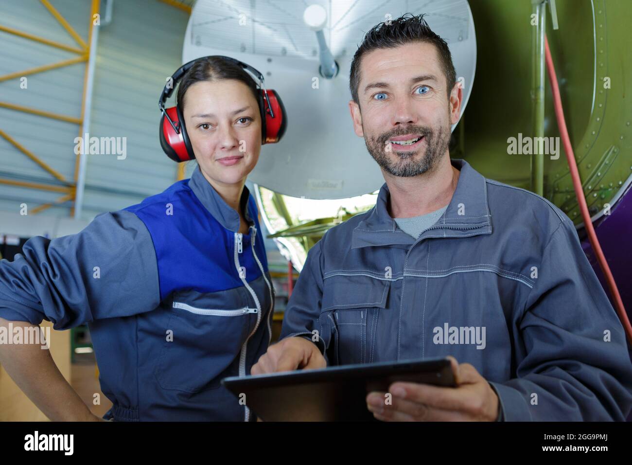 two engineers working on satellite dish Stock Photo Alamy