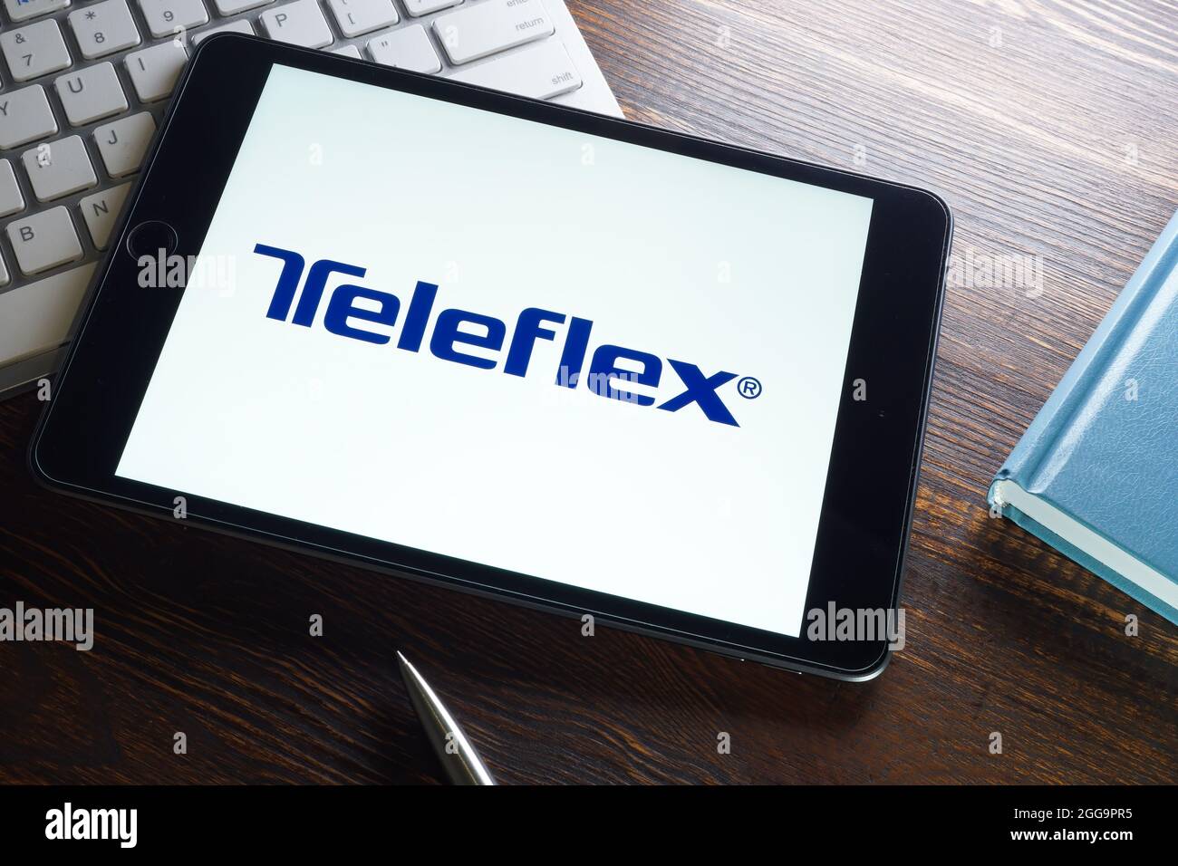 KYIV, UKRAINE - August 21, 2021. Teleflex inc TFX logo company and keyboard. Editorial. Stock Photo