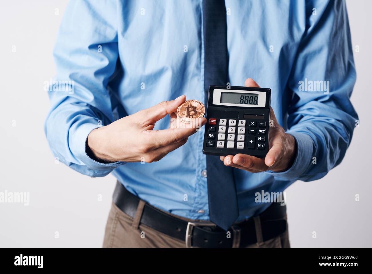 man holding a calculator cryptocurrency bitcoin virtual money investment  Stock Photo - Alamy