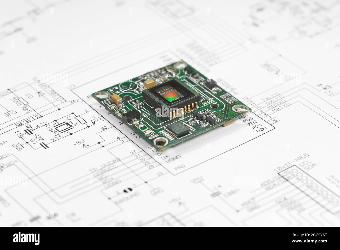 The circuit board with the CMOS sensor lies on the circuit diagram Stock Photo
