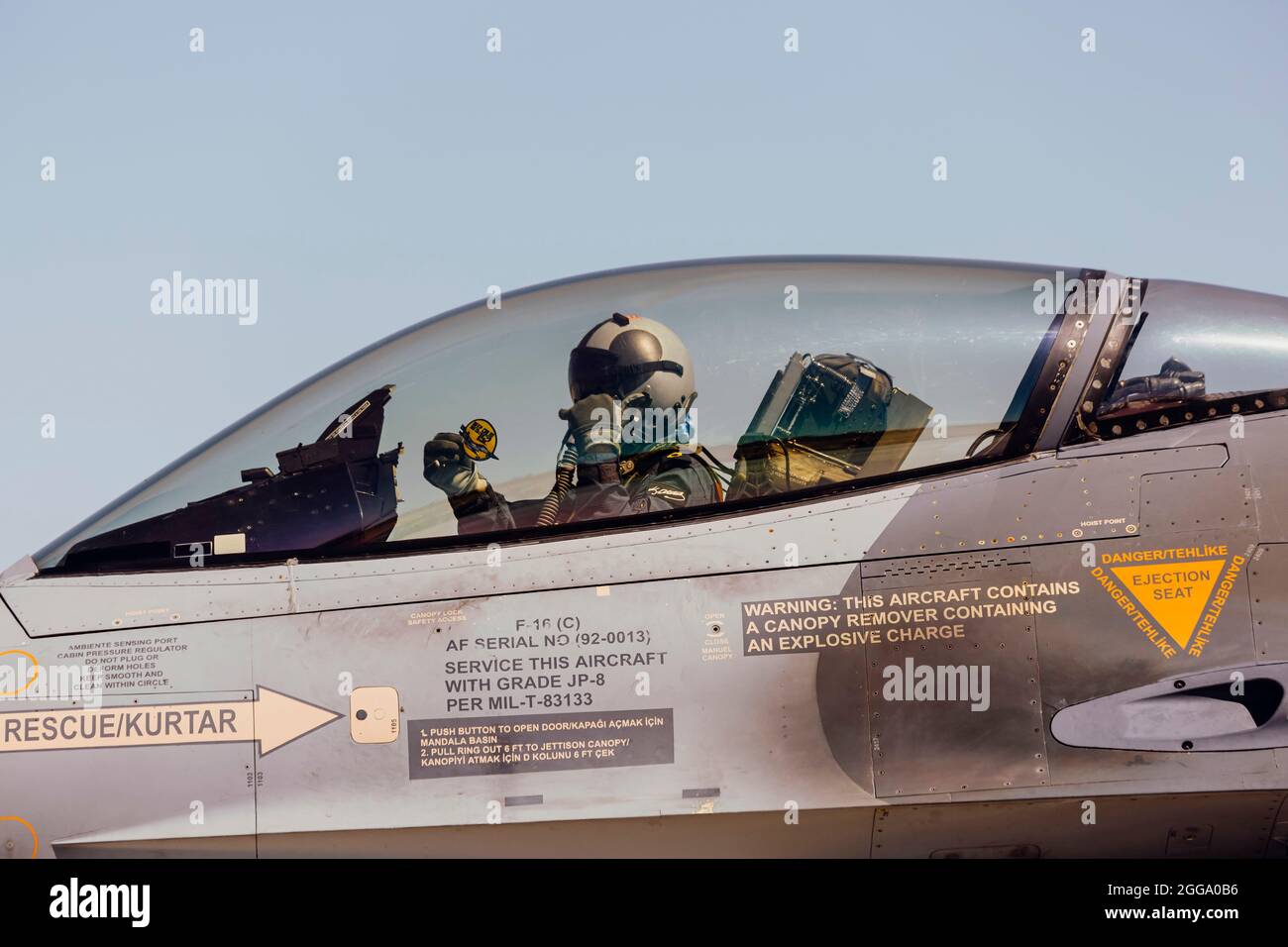 Konya, TURKEY - 07.01.2021: IN THE ANATOLIAN EAGLE 2021 TRAINING; Turkish fighter pilot saluting while taking a taxi Stock Photo