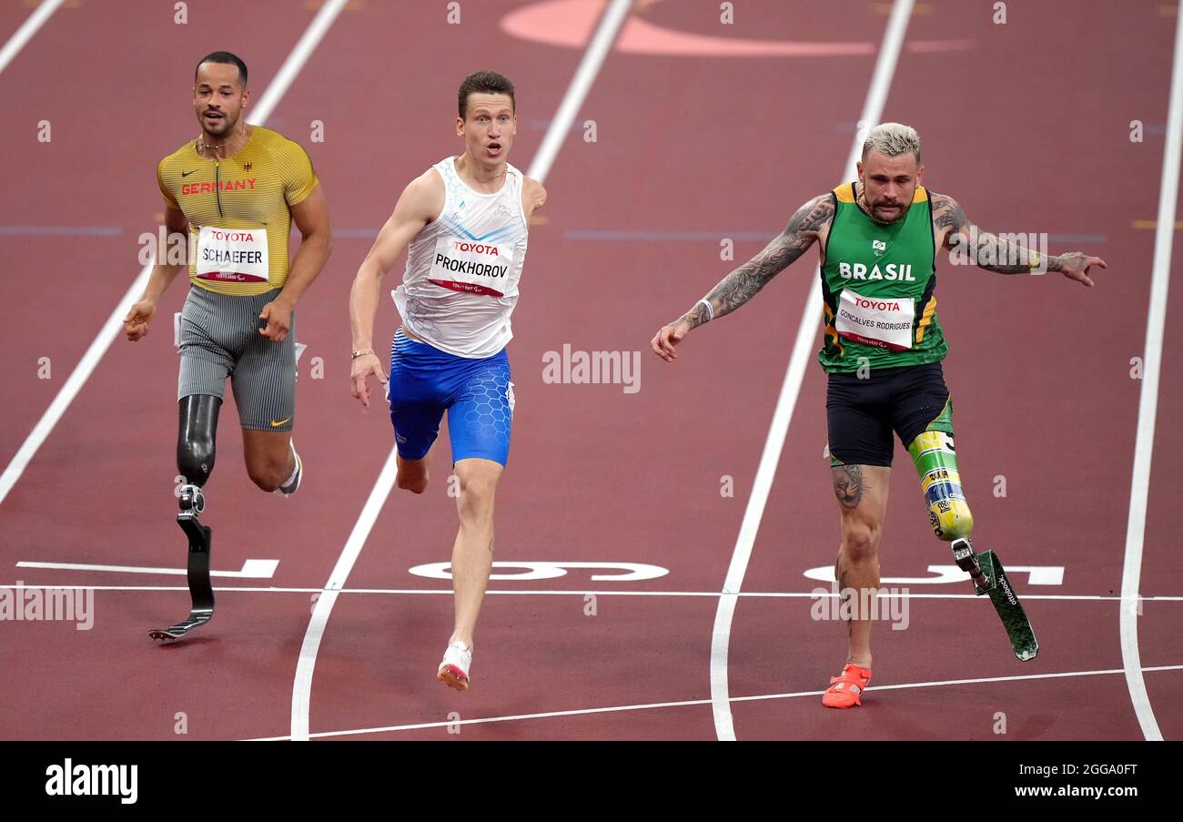 Russian Paralympic Committee's Anton Prokhorov wins the Men's 100m - T63 Final ahead of Brazil’s Vinicius Gonçalves Rodrigues (Silver) and Germany’s Leon Schaefer (Bronze) during the Athletics at the Olympic Stadium on day six of the Tokyo 2020 Paralympic Games in Japan. Picture date: Monday August 30, 2021. Stock Photo