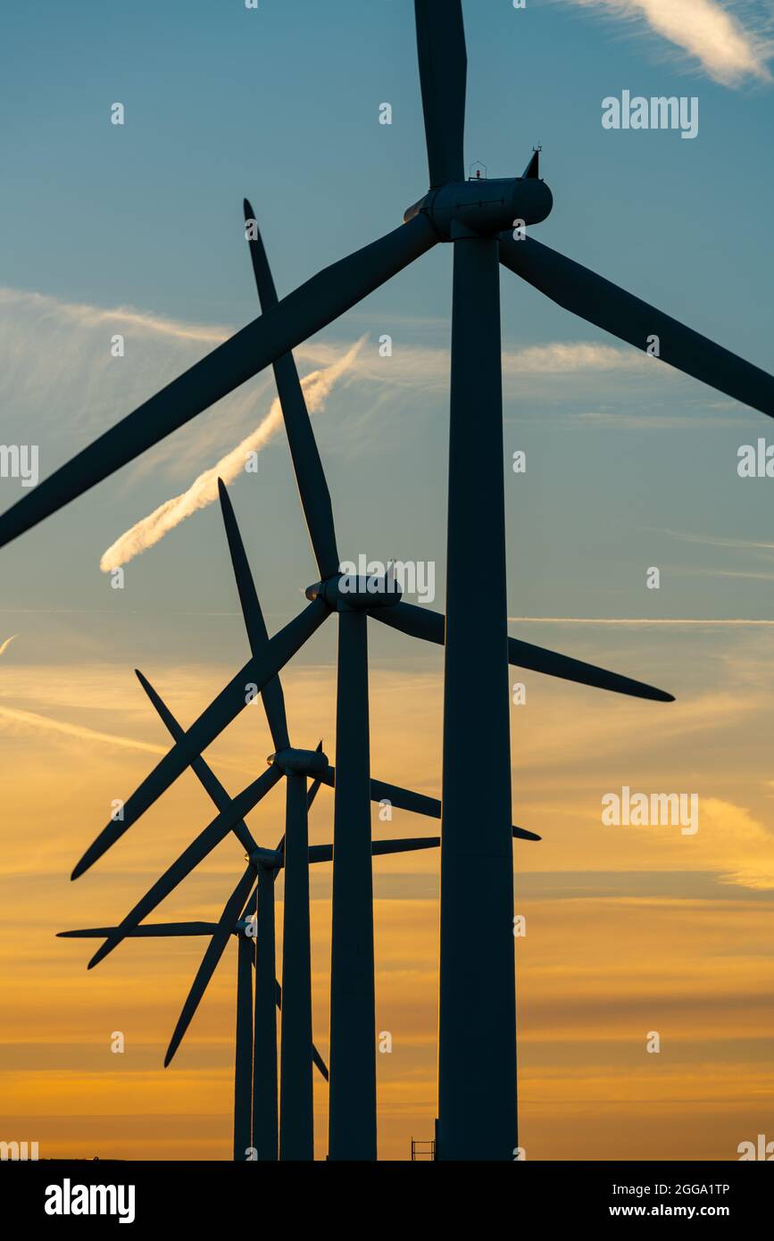 Wind turbine energy generators on wind farm Stock Photo