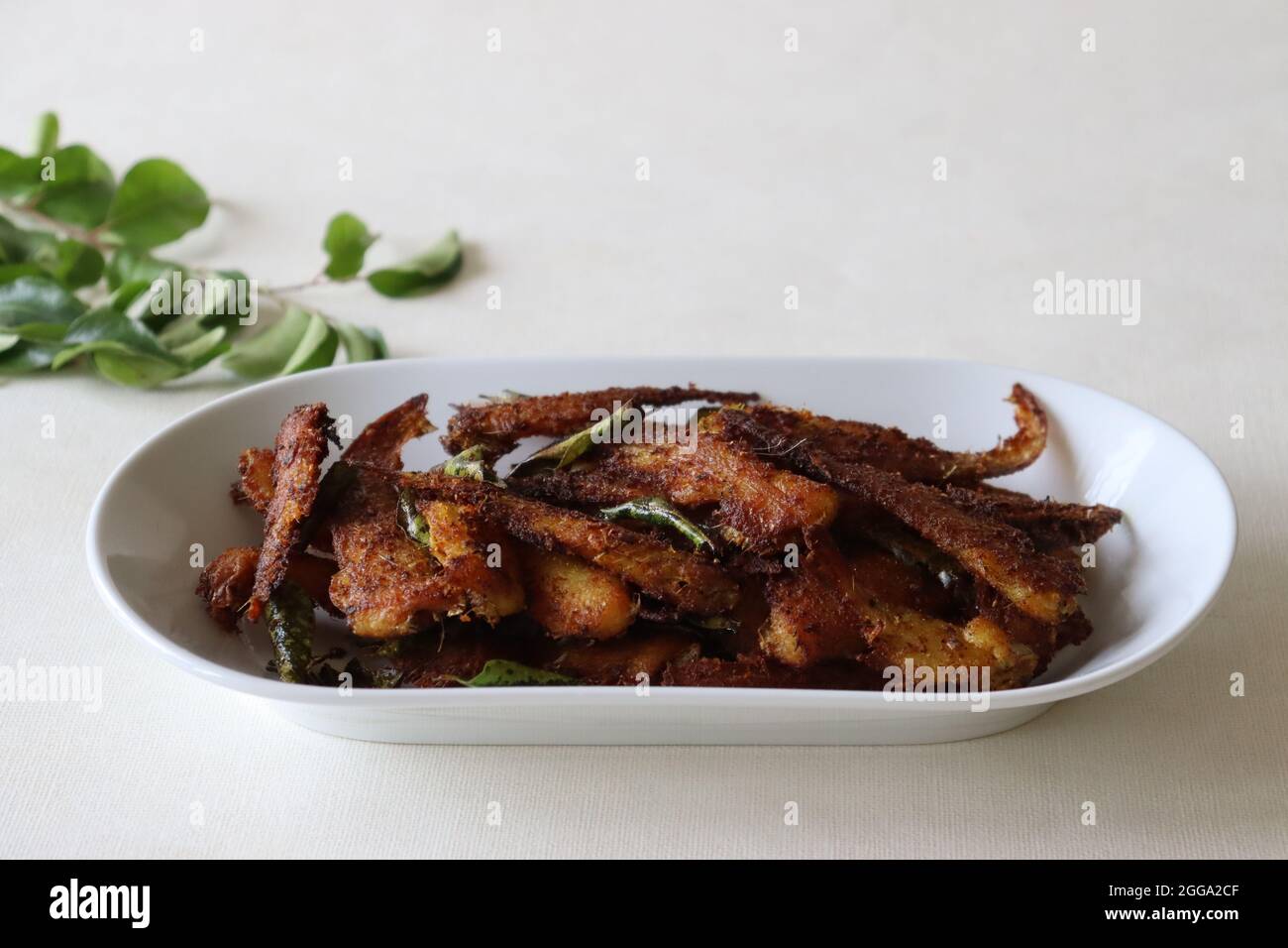 Crispy and spicy Anchovy fry. Anchovies marinated with spices and deep