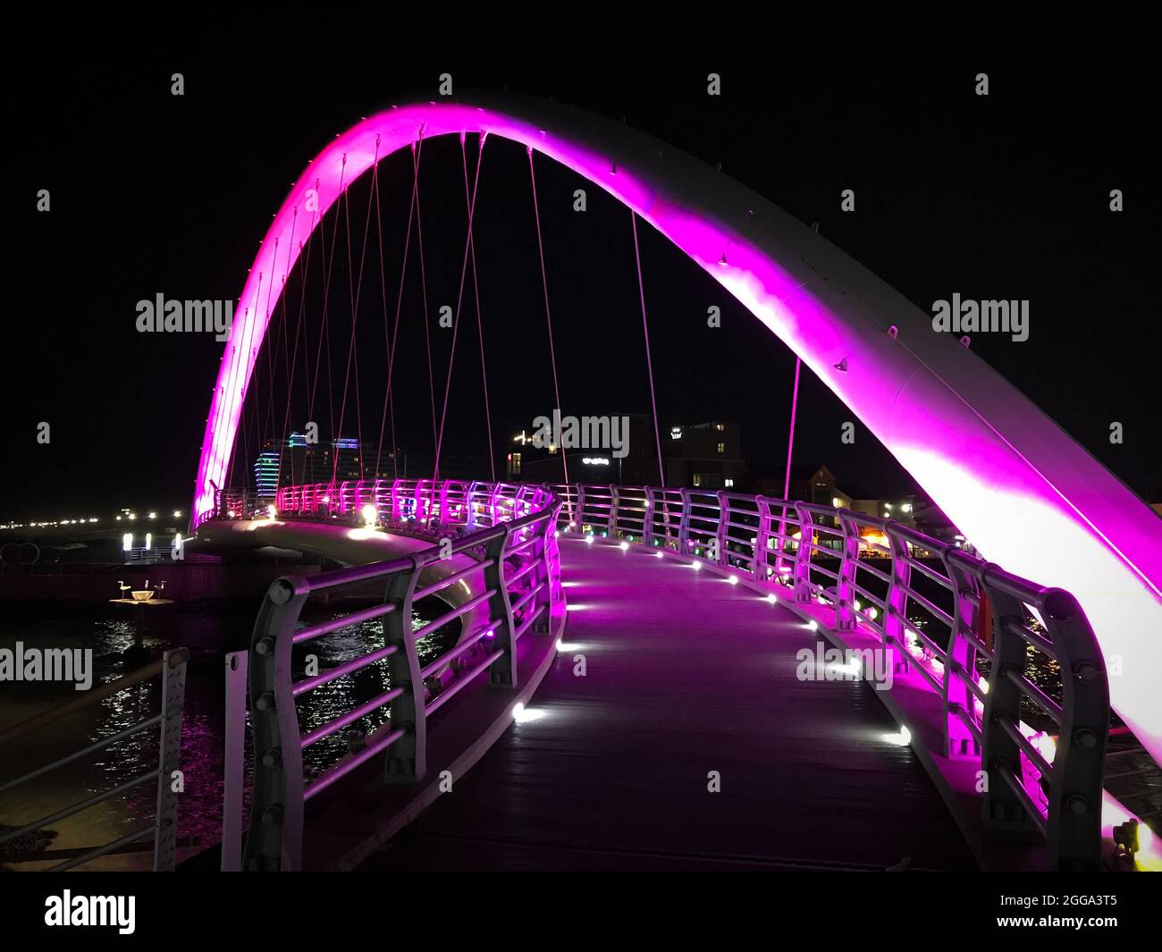 Gangneung, South Korea - February 18, 2018: Pink illuminated Gangmun Sotdae Bridge at night Stock Photo