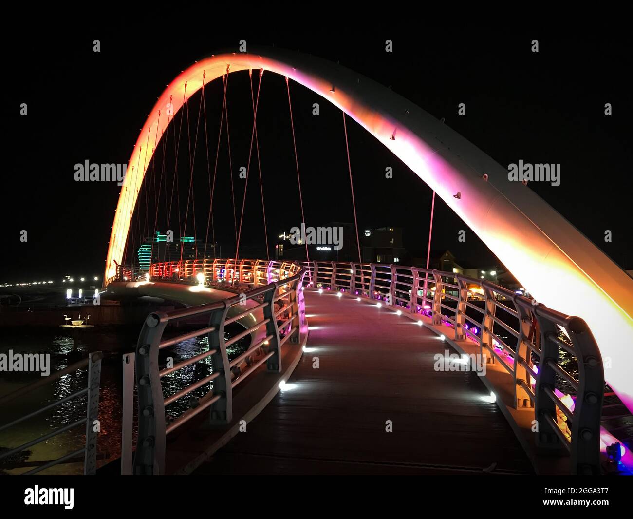 Gangneung, South Korea - February 18, 2018: Orange illuminated Gangmun Sotdae Bridge at night Stock Photo