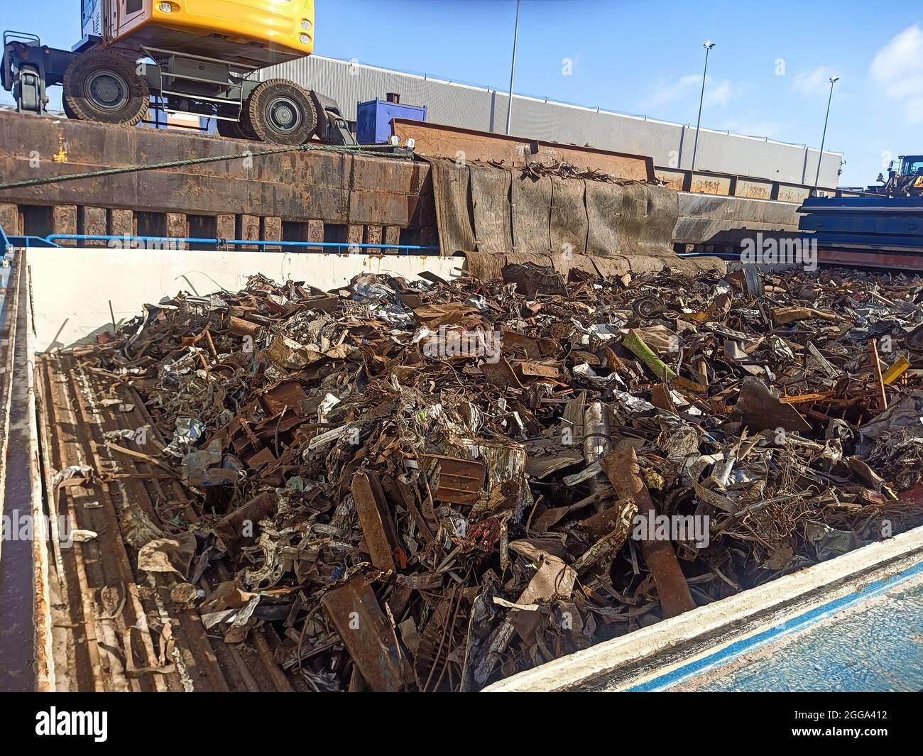 loading and unloading of scrap metal in the port on the berth from the