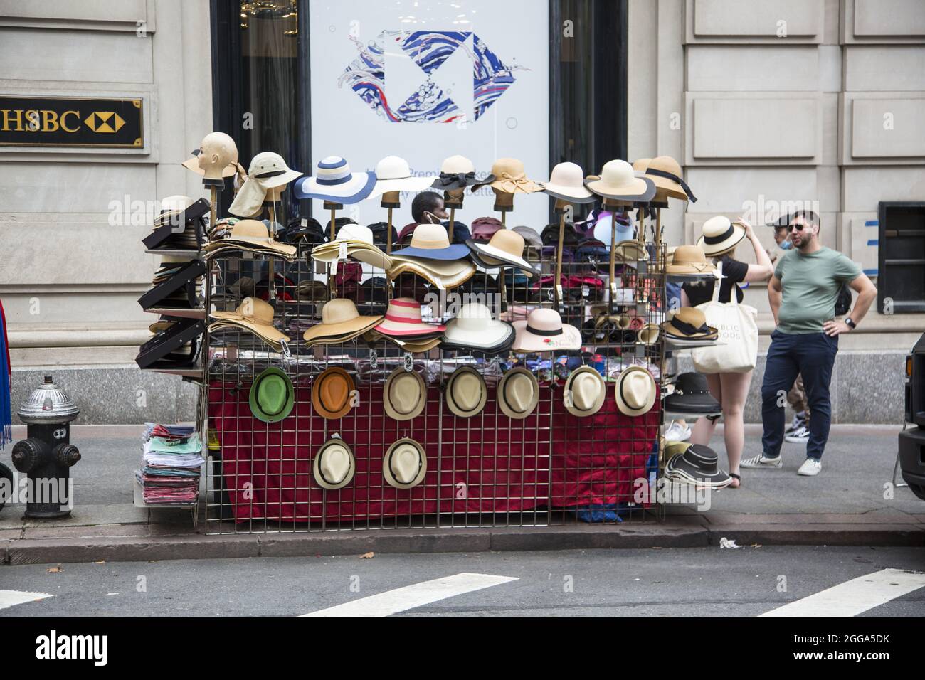 Street vendor sells hats on 42nd Street in New York City Stock Photo