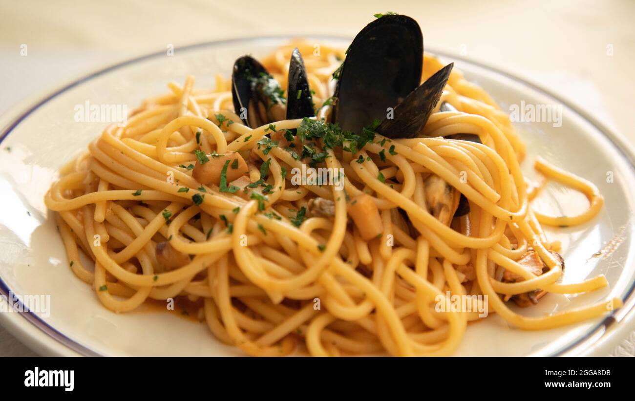 Pasta alla pescatora in Venice - Cuisine based on fish and seafood Stock Photo