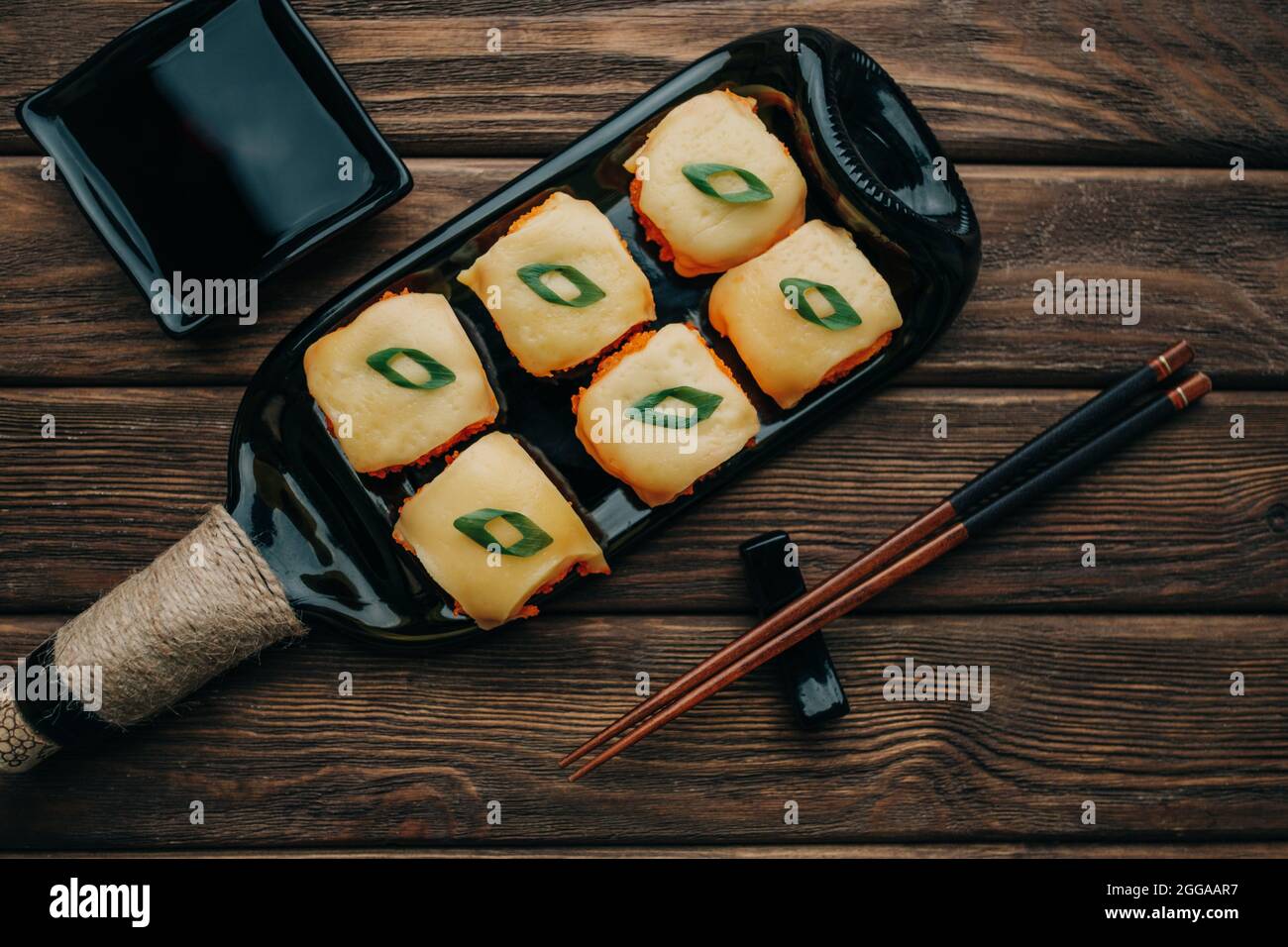 Sushi rolls set with tobiko caviar and cheese, top view. Stock Photo