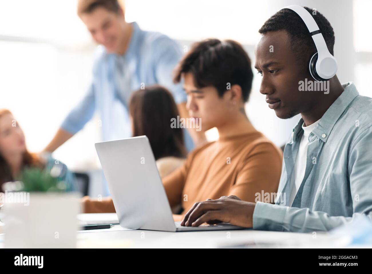 Colleagues working on a project using technology Stock Photo