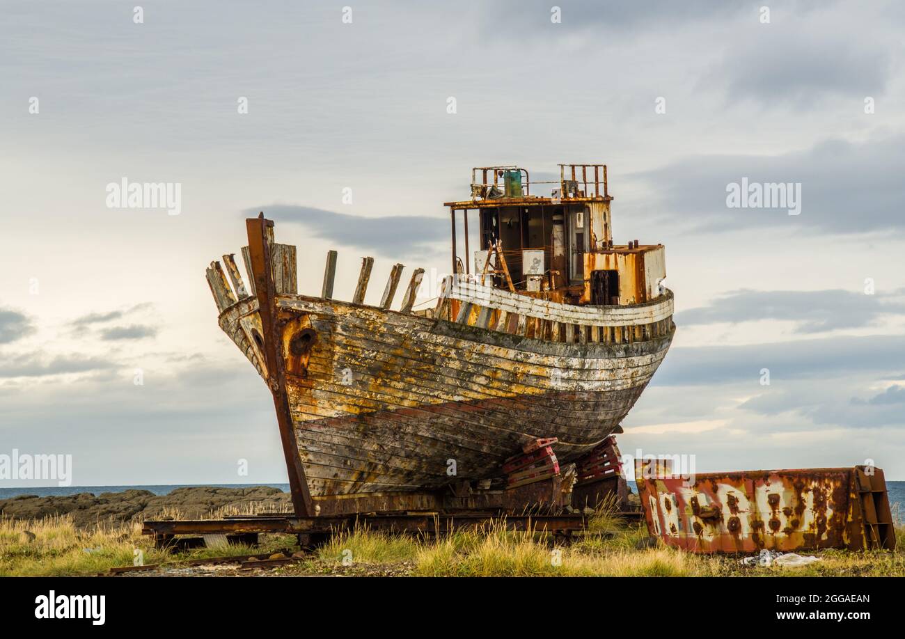 A beached fishing trawler at the coastal town of Akranes in Iceland Stock Photo