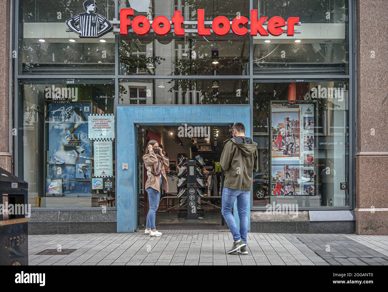 A couple seen entering the Foot Locker Footwear Store, in Donegall Place.  (Photo by Michael Mc Nerney / SOPA Images/Sipa USA Stock Photo - Alamy