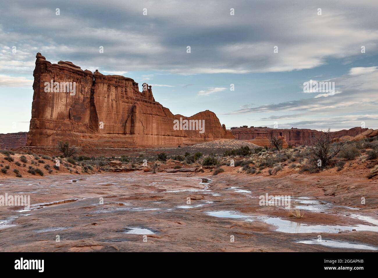 Courthouse Towers sandstone formation and potholes on Park Avenue, Arches National Park, Moab, Utah USA Stock Photo