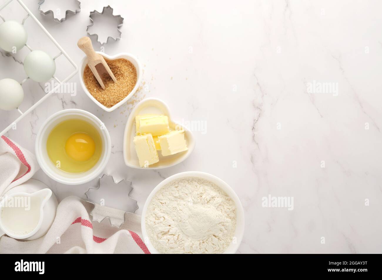 Baking background with flour, eggs, kitchen tools, utensils and cookie ...