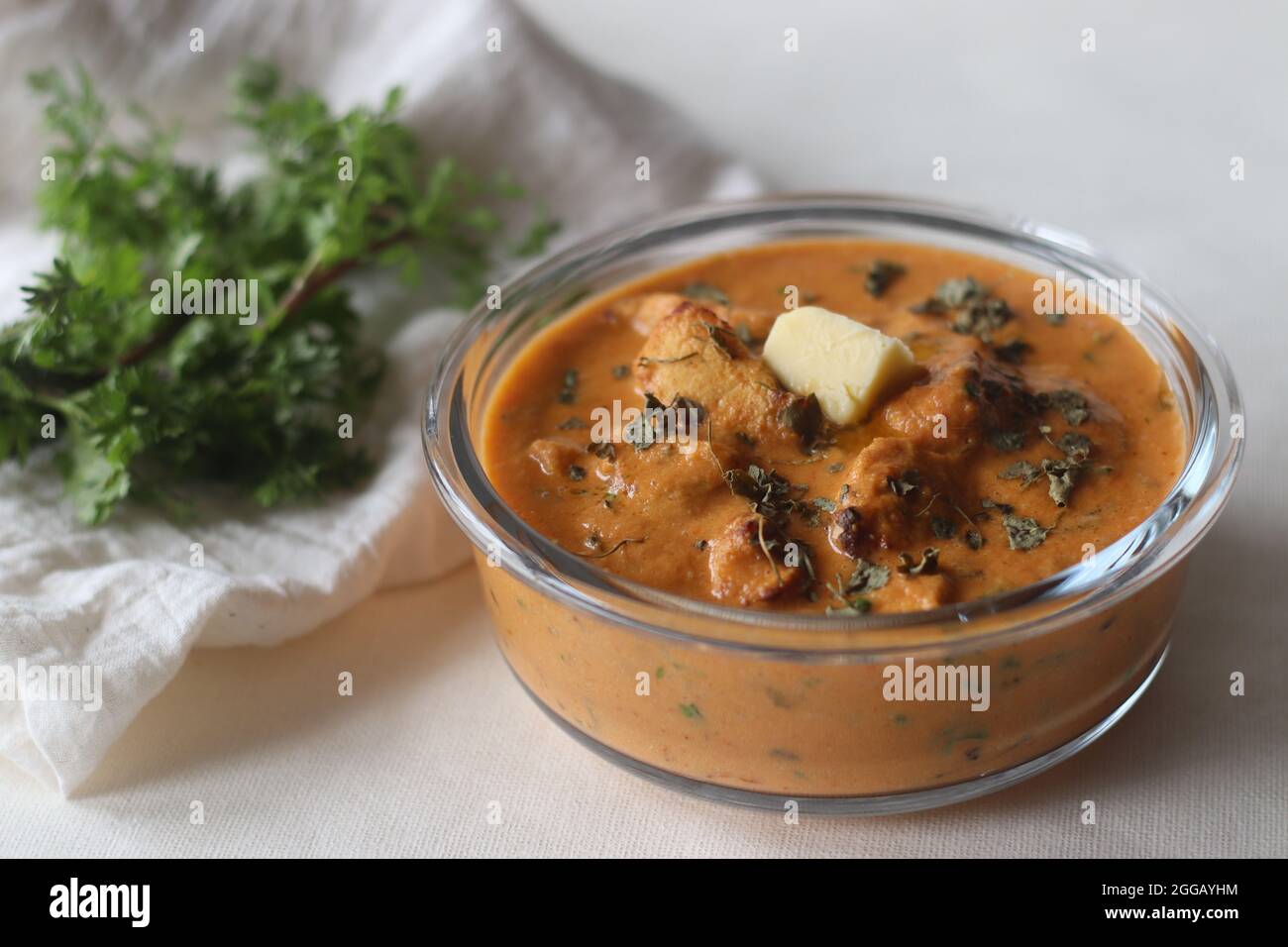 Butter chicken. Chunks of grilled or tandoori chicken cooked in a smooth buttery and creamy tomato based gravy. It is also known as murgh makhani. Sho Stock Photo