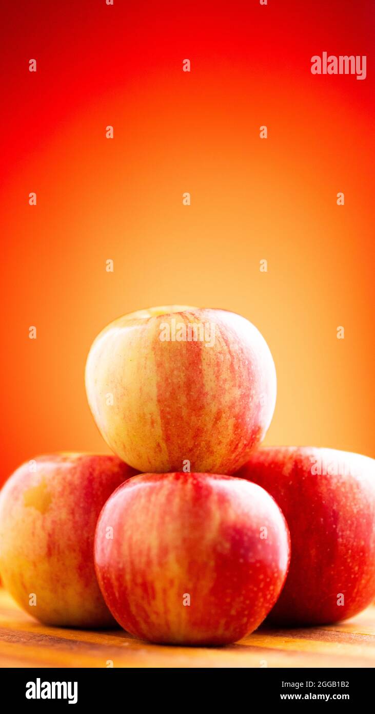 Large fresh red apple on red background gala schnico brookfield mema