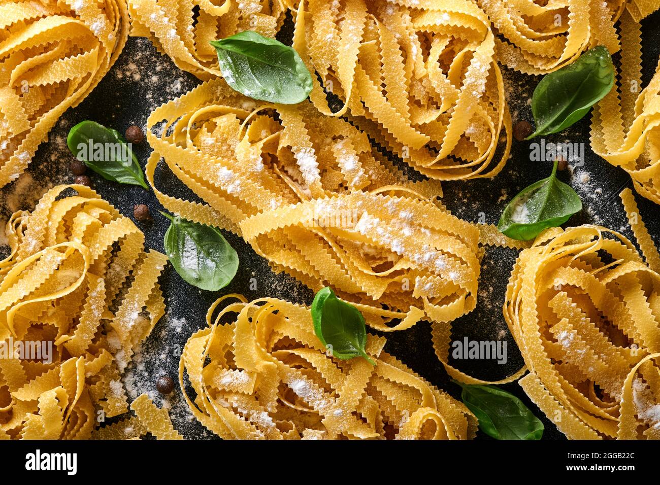 Tagliatelle. Homemade pasta, basil leaves, flour, pepper, olive oil and