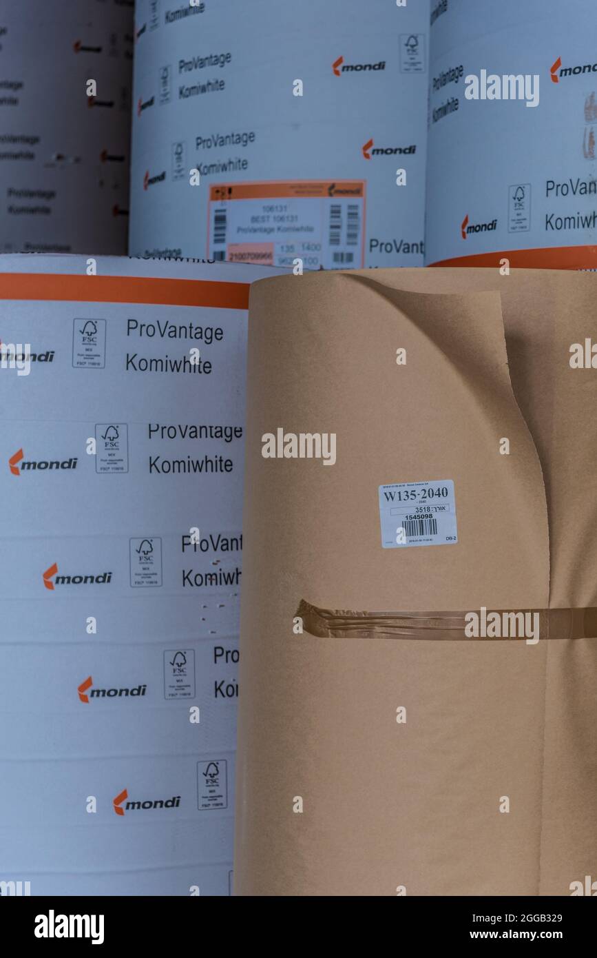 Paper is converted into corrugated cardboard made of multiple corrugated and flat layers. This