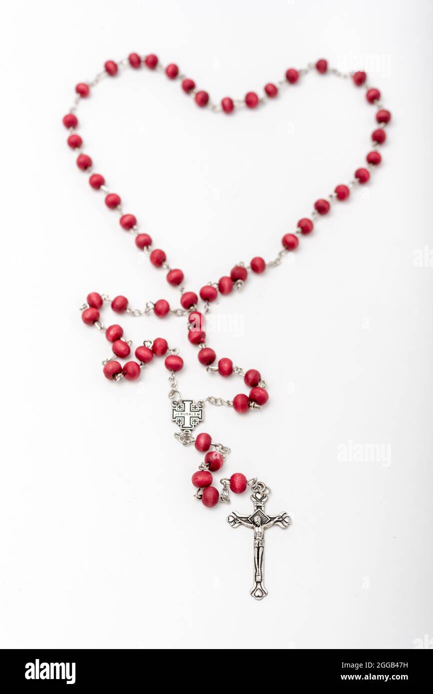 Christian souvenirs from the Holy Land Olive wood Rosary and crucifix on white background Stock Photo
