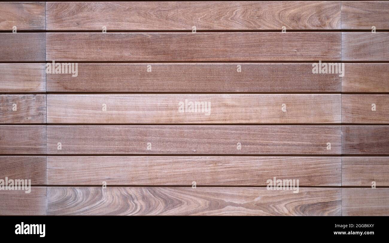detail of a panel of weather resistant teak veneer panels Stock Photo