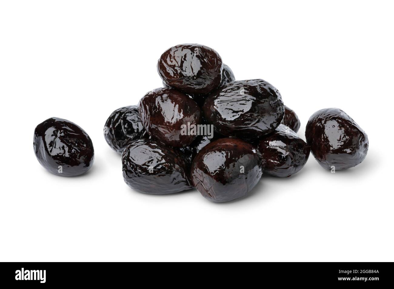 Heap of traditional Moroccan black breakfast olives close up isolated on white background Stock Photo