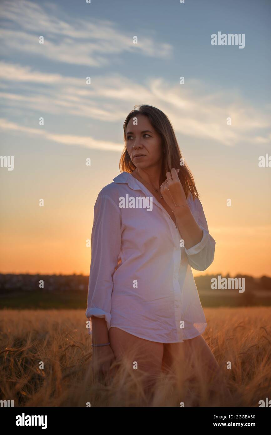 Aerial view of woman lying in the yellow field of wheat Stock Photo - Alamy