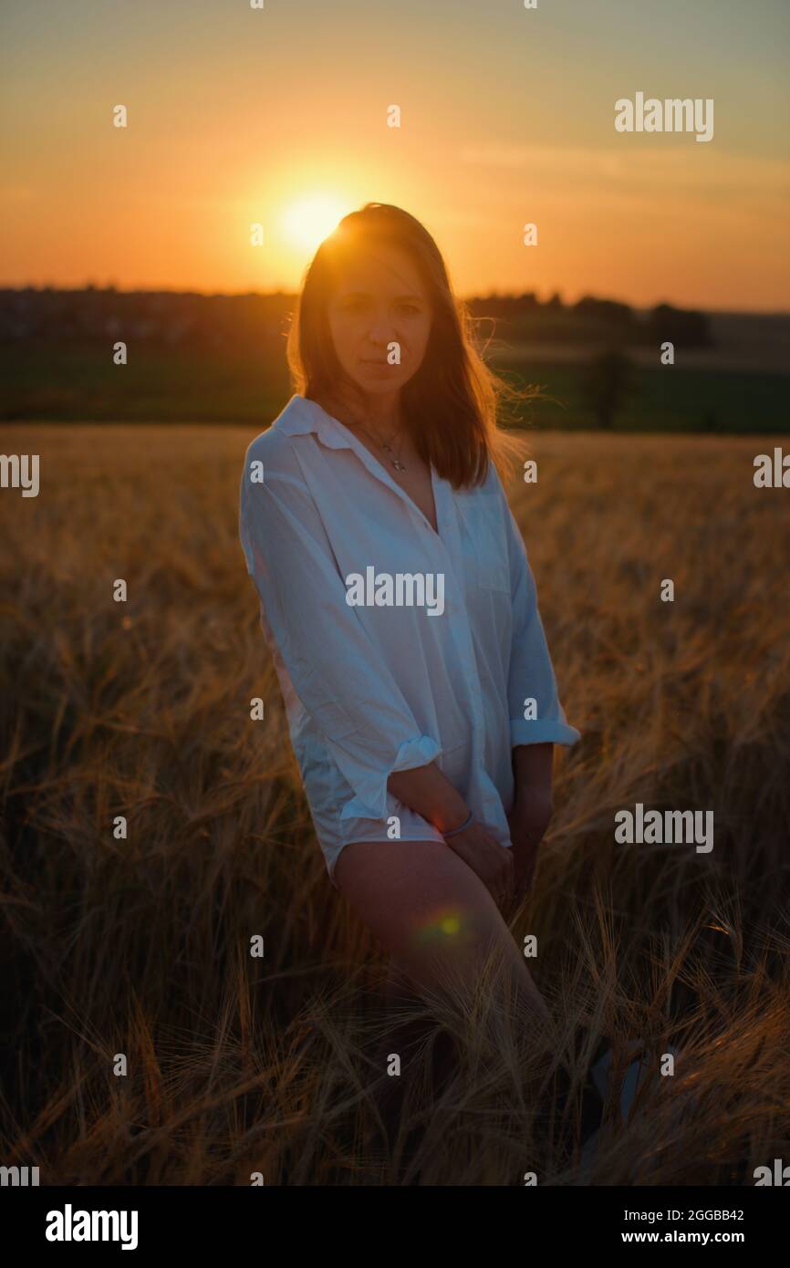 Aerial view of woman lying in the yellow field of wheat Stock Photo - Alamy
