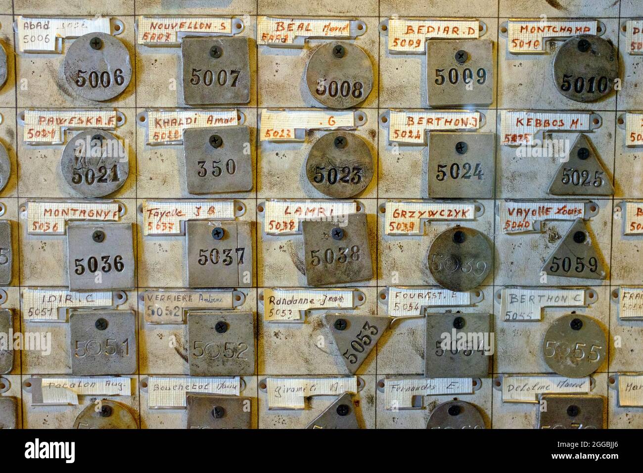 Miner's ID tags in la lampisterie (lamp room) at Saint-Etienne Mine Museum, France Stock Photo