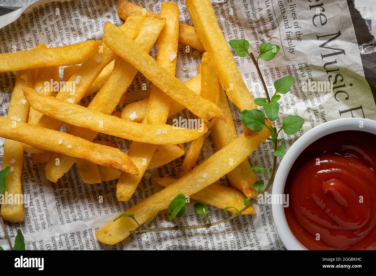 French fries on paper with crumbled feta cheese Stock Photo Alamy