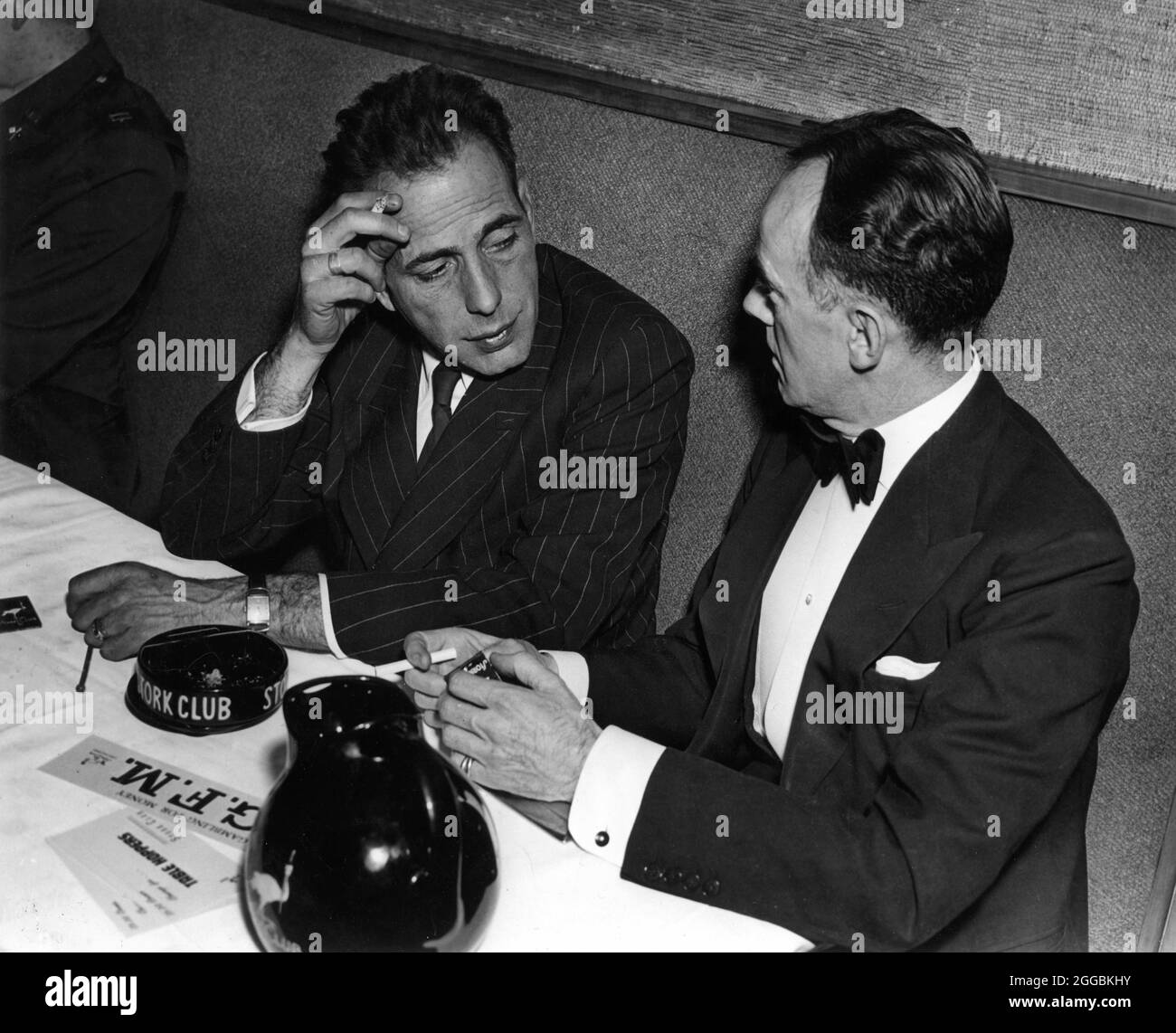 HUMPHREY BOGART at Sherman Billingsley's STORK CLUB in New York with
