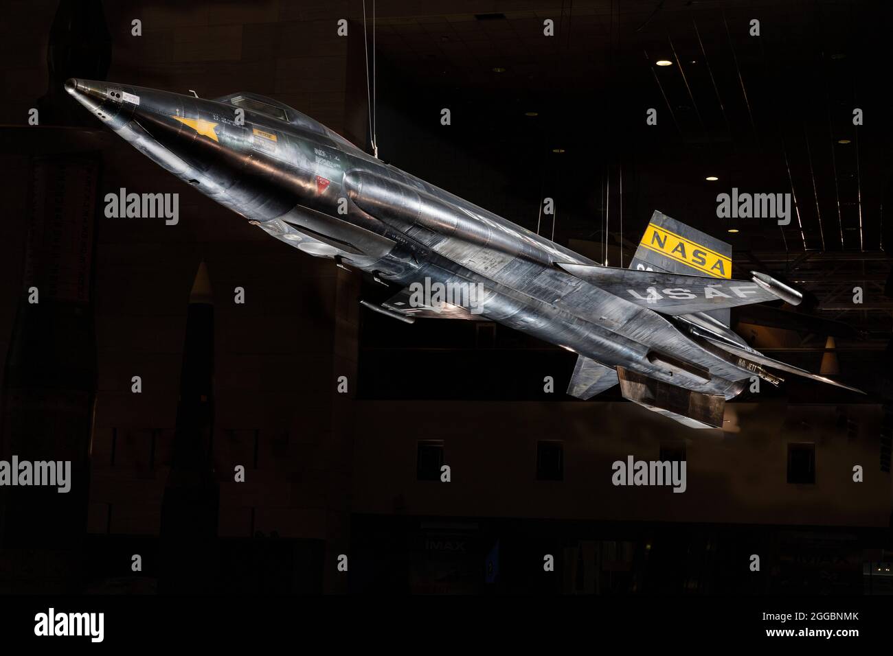 World's Fastest Piloted Aircraft. Piloted by Neil Armstrong. Bridged the gap between human flight in the atmosphere and spaceflight. North American X-15, rocket powered experimental aircraft; black titanium skin with wedge shaped horizontal stablizer; yellow stripe NASA inisignia on tail with stars and red bars United States national insignia on wings; white letter text &quot;U.S. AIR FORCE&quot; on the sides of the fuselage. Stock Photo