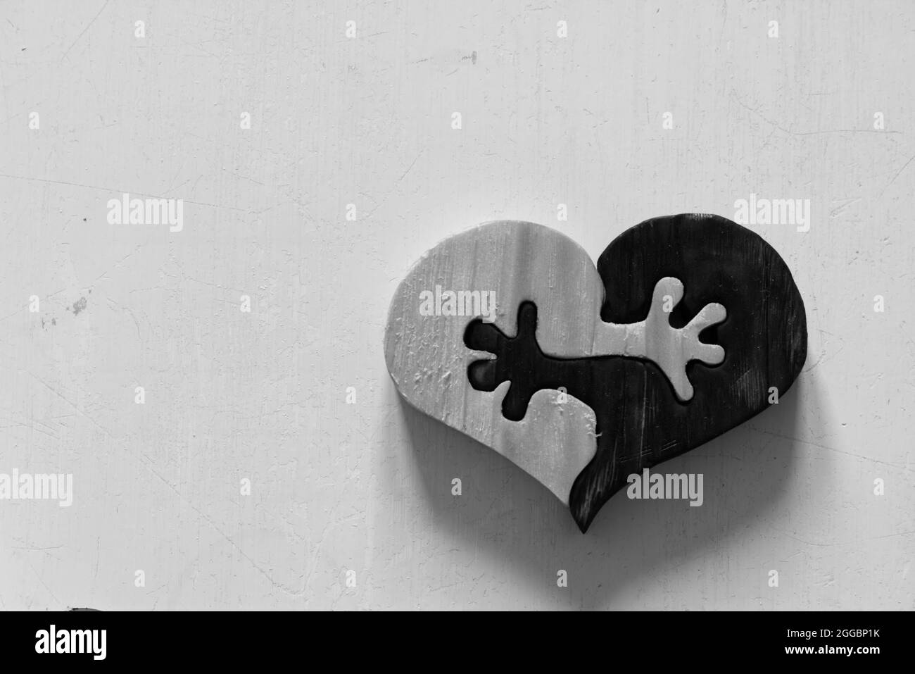 wooden heart ying yang hands Stock Photo