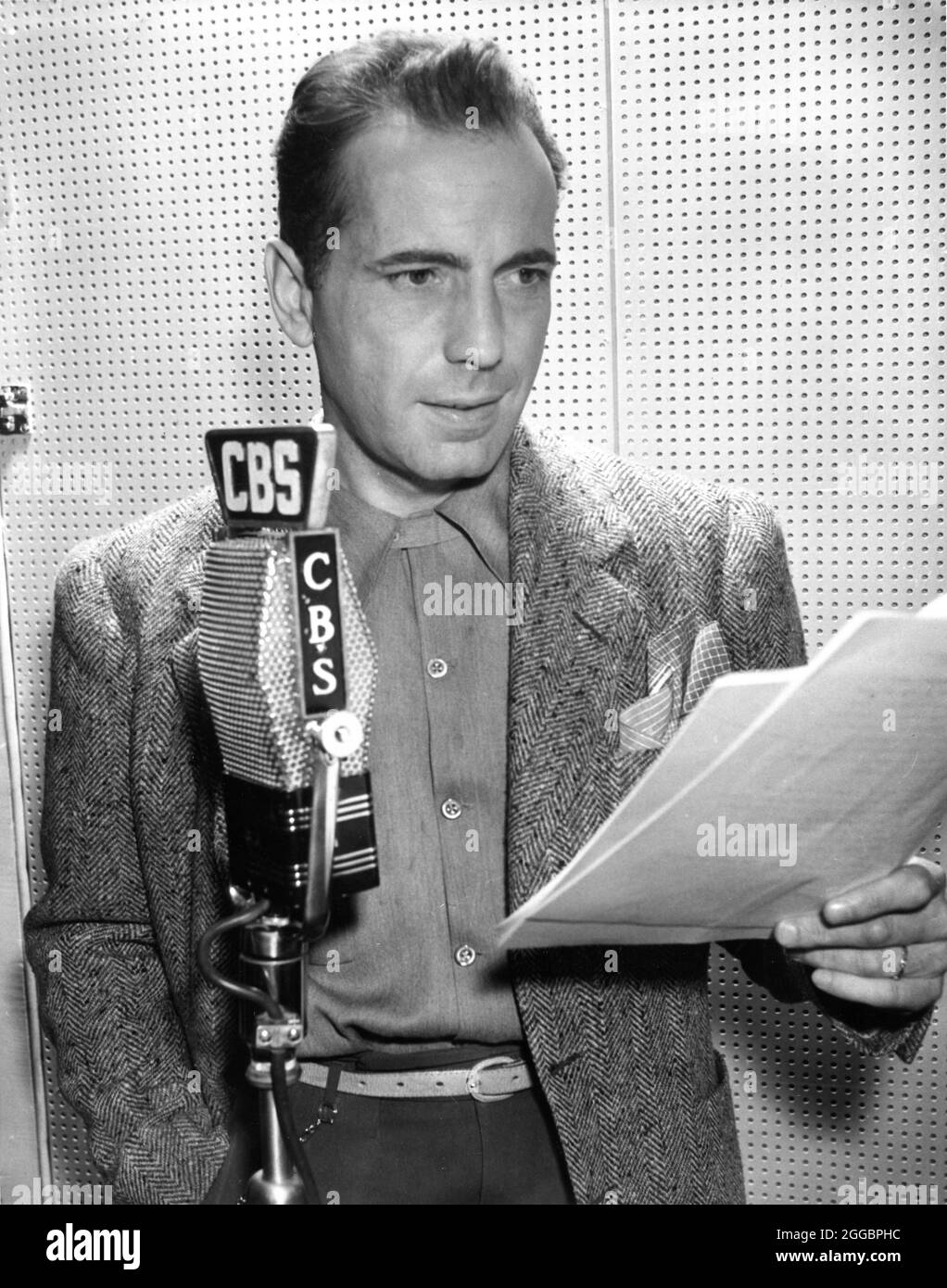 HUMPHREY BOGART candid playing the leading role in LOVE'S LOVELY COUNTERFEIT by JAMES M. CAIN on the SUSPENSE Radio Series for CBS broadcast on Thursday March 8th 1945 publicity for Columbia Broadcasting System Stock Photo