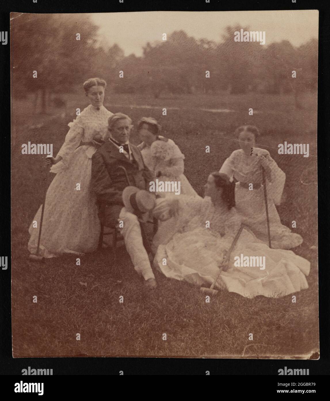 Group portrait of Joseph Henry (1797-1878) and family, circa 1865. Smithsonian secretary Joseph Henry with wife Harriet Alexander Henry, and three daughters, Caroline Henry, Mary Henry, and Helen Louisa Henry, holding croquet mallets on Smithsonian grounds. Stock Photo