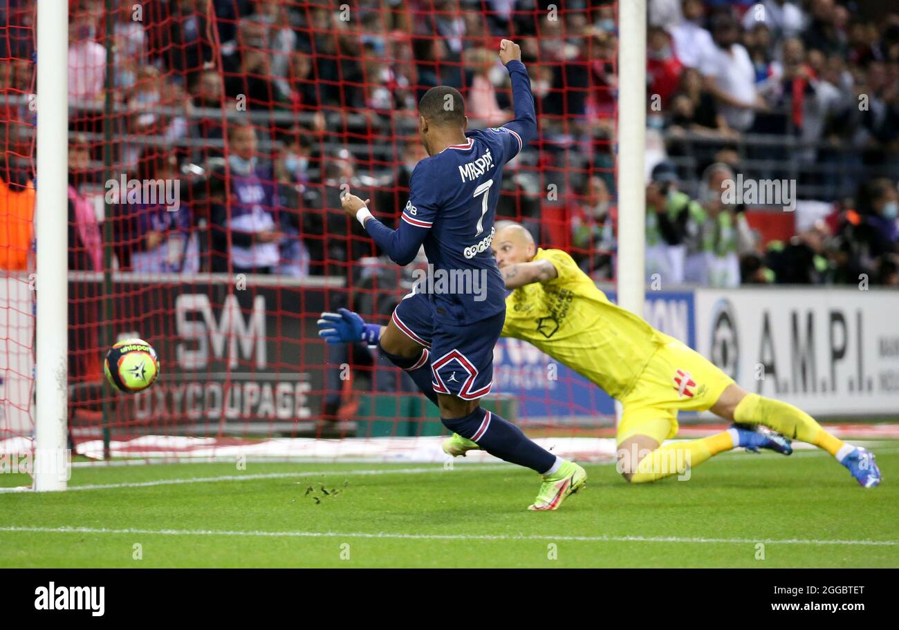Kylian Mbappe of PSG scores his second goal against goalkeeper of Reims Predrag Rajkovic during the French championship Ligue 1 football match between Stade de Reims and Paris Saint-Germain on August 29, 2021 at Auguste Delaune stadium in Reims, France - Photo Jean Catuffe / DPPI Stock Photo