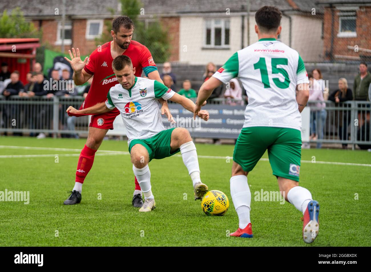 Isthmian Premier League Football (soccer) 2021: Worthing vs Bognor Regis Town FC. Bank Holiday action as players tackle and shirt pull. Local derby. Stock Photo