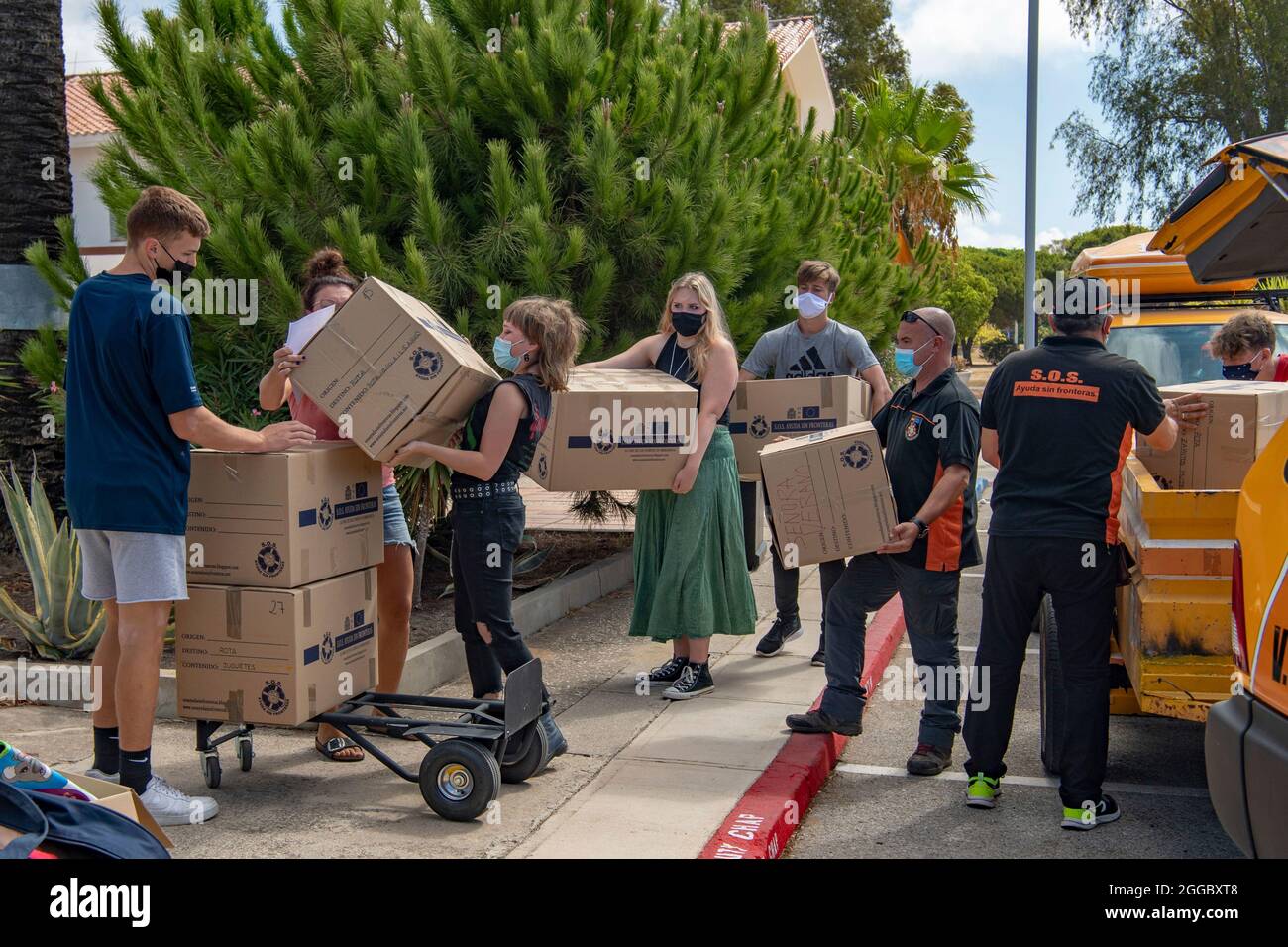 Rota, Spain. 29th Aug, 2021. Volunteers move boxed donations for Operations Allies Refuge to support Afghan refugees evacuated from Kabul August 29, 2021 in Rota, Spain. NAS Rota is providing temporary lodging for evacuees from Afghanistan as part of Operation Allies Refuge. Credit: Planetpix/Alamy Live News Stock Photo