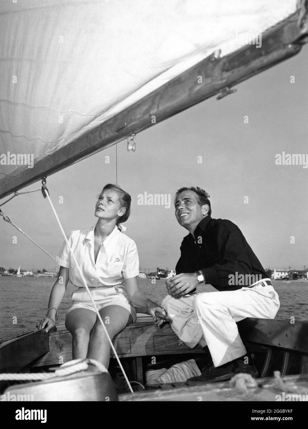 HUMPHREY BOGART and LAUREN BACALL on their boat SANTANA 1946 photo by FLOYD McCARTY publicity for Warner Bros. Stock Photo