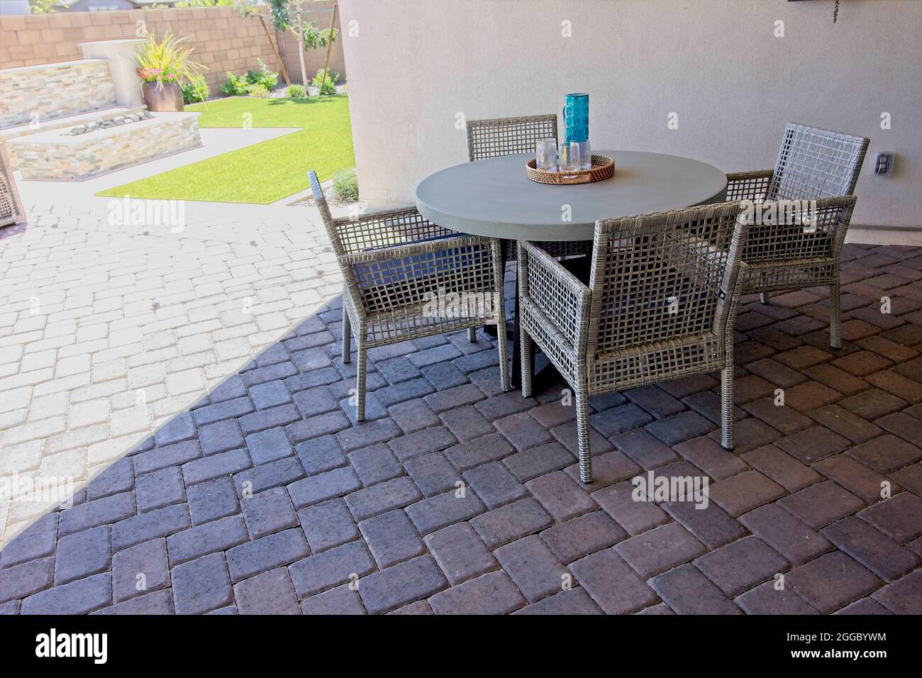Patio Table And Four Wicker Arm Chairs Stock Photo - Alamy