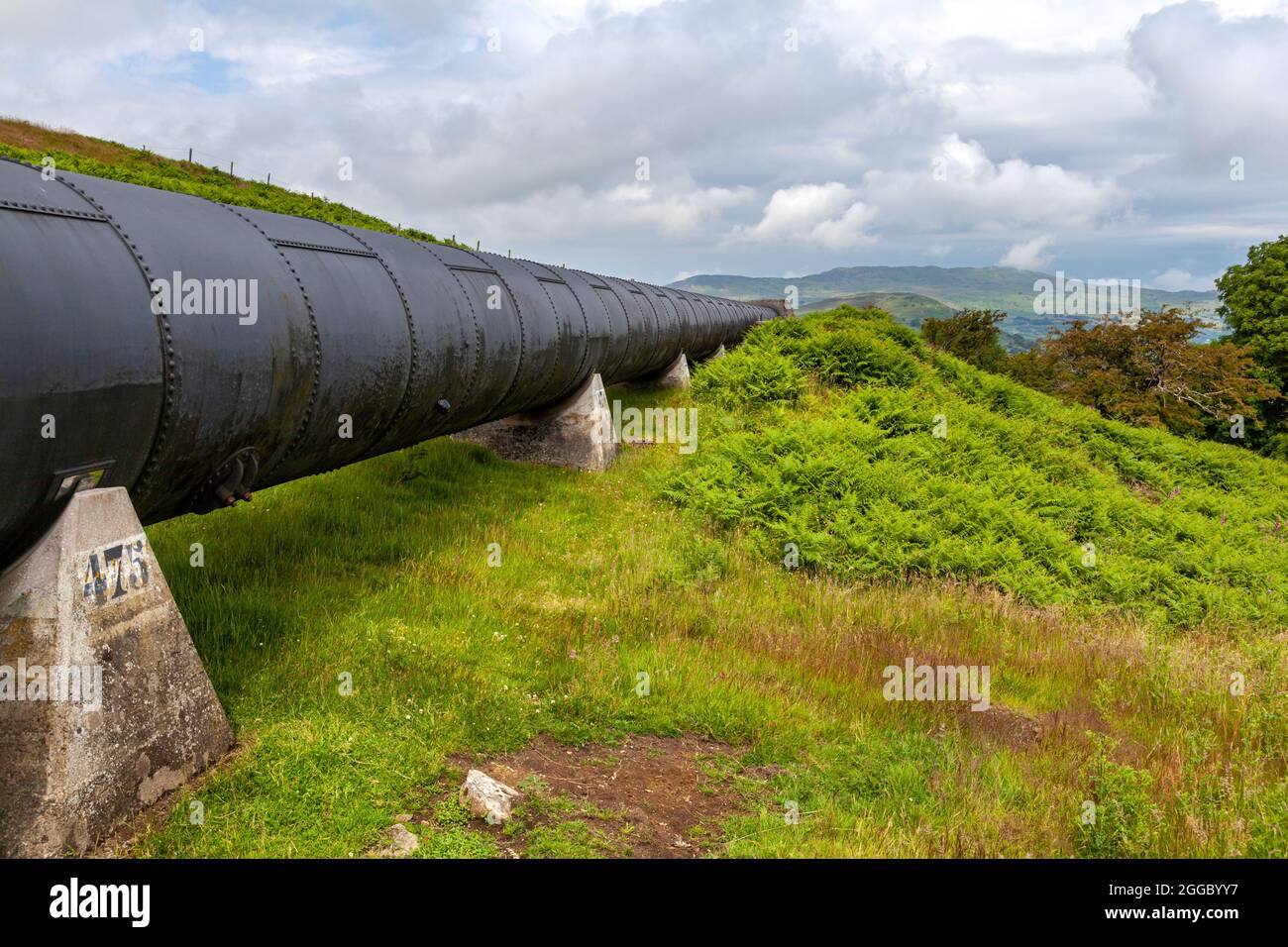 One of the pipes carrying water to the Hydro electric power station at Dolgarrog, Snowdonia Natinal Park Stock Photo